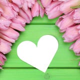 Tulips flowers with heart on mothers or Valentine's day and copy Stock Photography Tulips flowers with heart on mothers or Valentine's day and copy Stock Photography