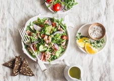 Tuna, Arugula, Tomato, Cucumber Salad With Mustard Dressing. Healthy Diet Food. Mediterranean Style. On A Light Background Stock Images Tuna, Arugula, Tomato, Cucumber Salad With Mustard Dressing. Healthy Diet Food. Mediterranean Style. On A Light Background Stock Images