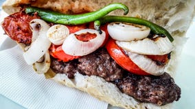 Turkish Kofte Ekmek / Meatball Sandwich with tomatoes, onion and green pepper. royalty free stock photography Turkish Kofte Ekmek / Meatball Sandwich with tomatoes, onion and green pepper. royalty free stock photography