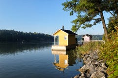 Two traditional Finnish wooden sauna log cabins