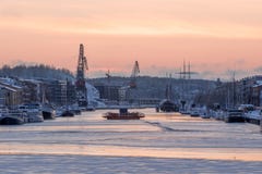 Föri ferry on frozen Aurajoki river during sunset