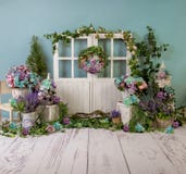 Turqoise spring sett up with colourful flowers pink , purple, bleu, and turqoise  flowers, vintage wood parquet