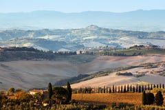 Tuscany landscape at sunrise. Tuscan farm house, vineyard, hills. royalty free stock photography Tuscany landscape at sunrise. Tuscan farm house, vineyard, hills. royalty free stock photography