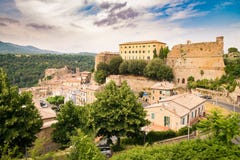 Tuscany, Sorano medieval village on tuff rocky hill. Stock Photography Tuscany, Sorano medieval village on tuff rocky hill. Stock Photography
