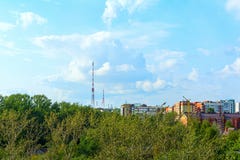 TV tower against the sky and the forest next to the city royalty free stock photo TV tower against the sky and the forest next to the city royalty free stock photo