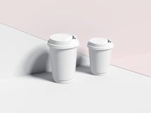 Twee witte lege document koffiekoppen het 3d teruggeven royalty-vrije stock afbeelding Twee witte lege document koffiekoppen het 3d teruggeven royalty-vrije stock afbeelding
