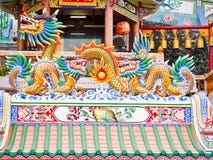 Twin china dragon and big dragon statue gold color on the roof royalty free stock photography Twin china dragon and big dragon statue gold color on the roof royalty free stock photography
