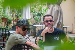 Two albanian mafia guys are smoking and drinking. royalty free stock photo Two albanian mafia guys are smoking and drinking. royalty free stock photo