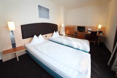 Two beds in hotel room stock photos Two beds in hotel room stock photos