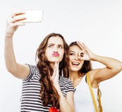 Two Best Friends Teenage Girls Together Having Fun, Posing Emotional On White Background, Besties Happy Smiling Stock Photos