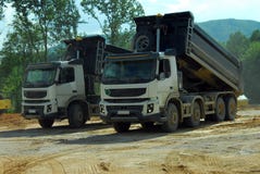 Two big trucks tipper at work Stock Photography Two big trucks tipper at work Stock Photography