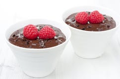 Two Bowls Of Chocolate Mousse And Raspberry On The White Stock Photos