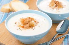 Two Bowls Of Cold Cauliflower Soup With Cottage Cheese Stock Photos