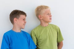 Two Boys In T-shirts Somewhere Looking Stock Photo