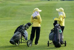 Two Caddies At A Golf Course Royalty Free Stock Photography Two Caddies At A Golf Course Royalty Free Stock Photography
