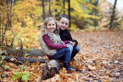 Children playing in beautiful autumn park on cold sunny fall day. royalty free stock photography Children playing in beautiful autumn park on cold sunny fall day. royalty free stock photography