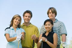 Two Couples Of Golfers Posing On Golf Course Stock Image Two Couples Of Golfers Posing On Golf Course Stock Image