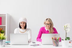 Two Creative Professionals Working Together Side By Side In The Office Royalty Free Stock Photo