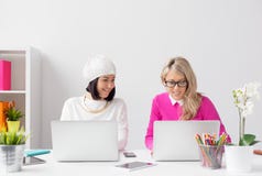 Two Creative Woman Working Together In Office Stock Photo