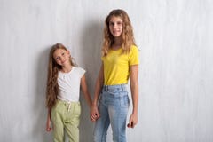 Two girls hold hands fashion portraits healthy eating fruit royalty free stock photography Two girls hold hands fashion portraits healthy eating fruit royalty free stock photography