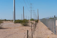 Two fences running parallel through the desert royalty free stock images Two fences running parallel through the desert royalty free stock images