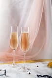 Two flute glasses with champagne on marble background Royalty Free Stock Photography Two flute glasses with champagne on marble background Royalty Free Stock Photography