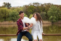 Two friends eating cotton candy together stock photos Two friends eating cotton candy together stock photos