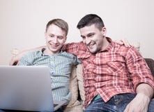 Two friends looking at computer Stock Image Two friends looking at computer Stock Image
