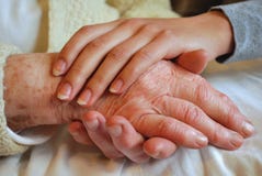 Two Generations embracing and Holding Hands stock images Two Generations embracing and Holding Hands stock images