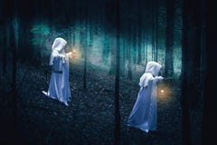 Two ghosts in a dark forest. Royalty Free Stock Photography Two ghosts in a dark forest. Royalty Free Stock Photography