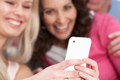 Two Girlfriends Looking At Pictures On Smartphone Royalty Free Stock Image Two Girlfriends Looking At Pictures On Smartphone Royalty Free Stock Image