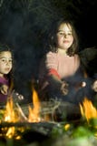 Two Girls At A Bonfire Royalty Free Stock Photos