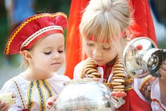 Two Girls In Russian National Costumes With Samovar Royalty Free Stock Photos Two Girls In Russian National Costumes With Samovar Royalty Free Stock Photos