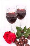 Two Glasses Of Wine With Rose And Candy Royalty Free Stock Image