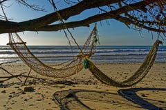 Two hammocks on the beach in the evening sunlight royalty free stock photography Two hammocks on the beach in the evening sunlight royalty free stock photography