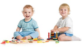 Two Happy Kids Playing Logical Toys Stock Image