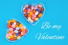 Two hearts with candies on blue background stock image Two hearts with candies on blue background stock image