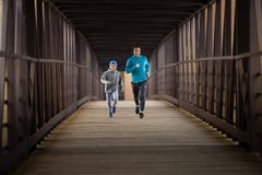 Two Hispanic Brothers Run A Race Down Bridge Royalty Free Stock Images Two Hispanic Brothers Run A Race Down Bridge Royalty Free Stock Images