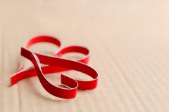 Two homemade paper red hearts on a cardboard background close up, the symbol of Valentine`s Day royalty free stock photo Two homemade paper red hearts on a cardboard background close up, the symbol of Valentine`s Day royalty free stock photo