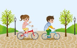 Two kids riding Bicycle, in the park Stock Images Two kids riding Bicycle, in the park Stock Images