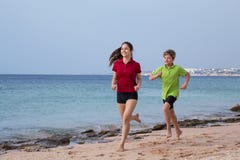 Two kids running together at morning exersises royalty free stock photo Two kids running together at morning exersises royalty free stock photo