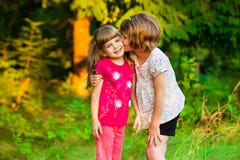 Two little girls playing fly in summer park. Concept of family. stock photo Two little girls playing fly in summer park. Concept of family. stock photo