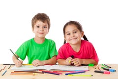 Two Little Kids Draw With Crayons Stock Images