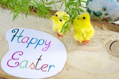 Two little yellow chickens and a Happy Easter card Royalty Free Stock Photo Two little yellow chickens and a Happy Easter card Royalty Free Stock Photo
