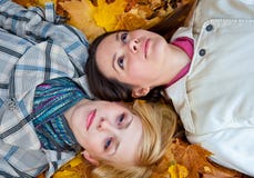 Two Lying Girls In Leaves Royalty Free Stock Photo