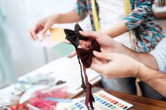 Two fashion designers looking at bow ties. royalty free stock photo Two fashion designers looking at bow ties. royalty free stock photo