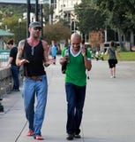 Two men walking and chatting on the street of Jacksonville royalty free stock photos Two men walking and chatting on the street of Jacksonville royalty free stock photos