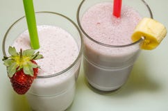 Two milkshakes with banana and strawberry stock photo Two milkshakes with banana and strawberry stock photo