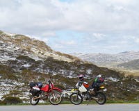 Two Motor Cycles In The Snowy Mountains Stock Image