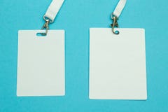 Two name tags on a blue background. Space for text and design. Close-up royalty free stock photography Two name tags on a blue background. Space for text and design. Close-up royalty free stock photography